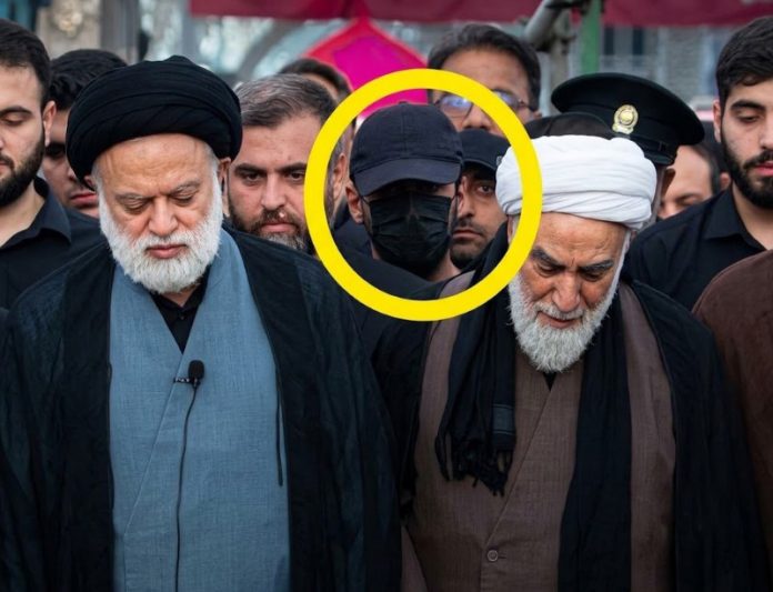 The identity of the masked figure seen at Khamenei's funeral has been revealed
